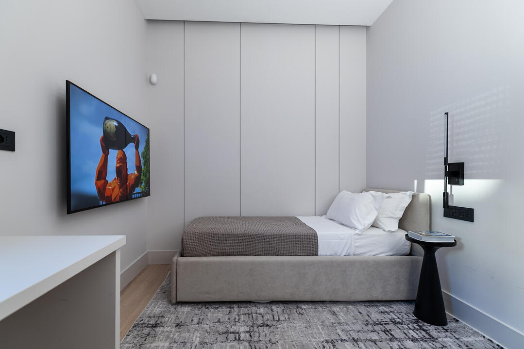 Second bedroom with 2 x 1 person beds and smart TV